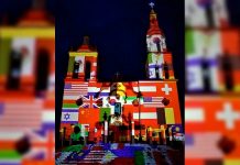Iluminan iglesia de Santiago con banderas de países afectados por coronavirus