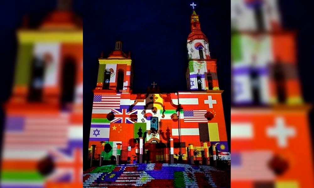 Iluminan iglesia de Santiago con banderas de países afectados por coronavirus